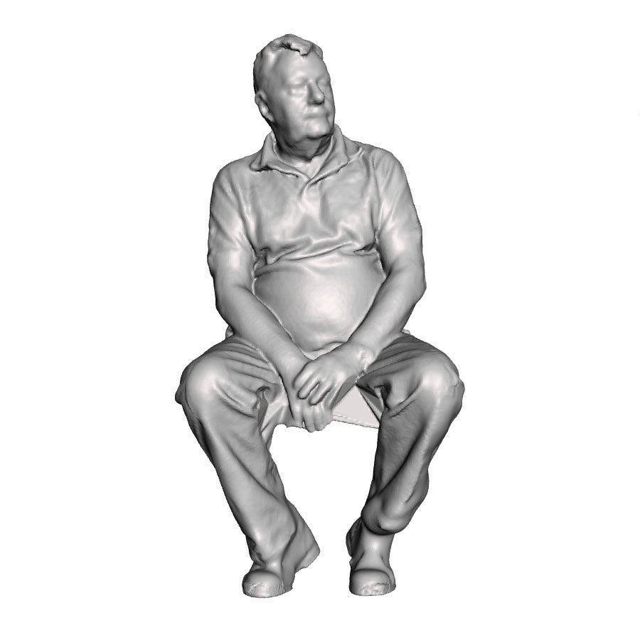 A male figure seated