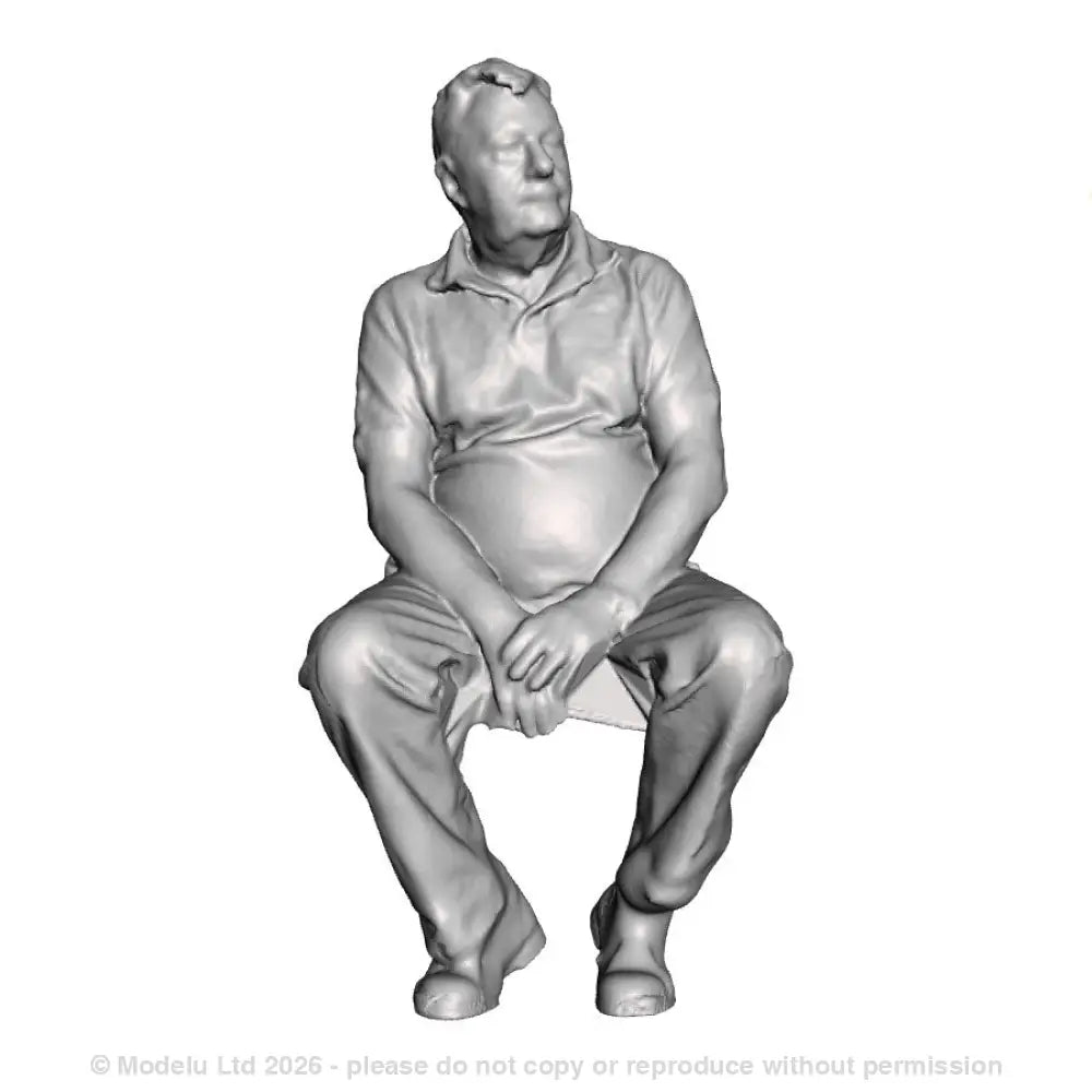 A male figure seated