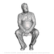 A male figure seated