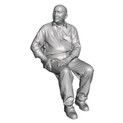 A male figure seated