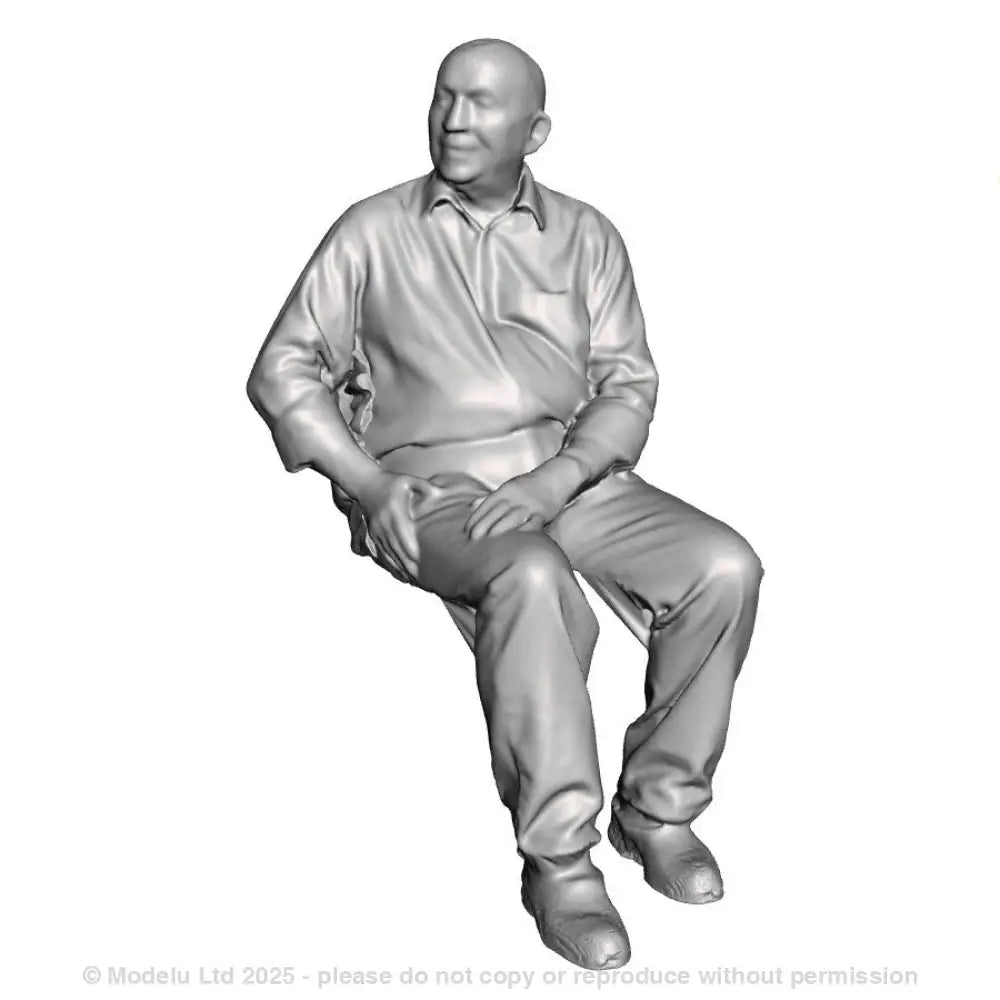 A male figure seated