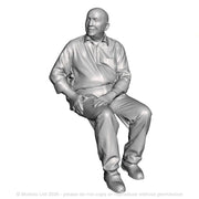 A male figure seated