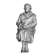 A female figure seated