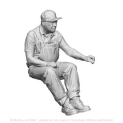 A seated engineer using regulator