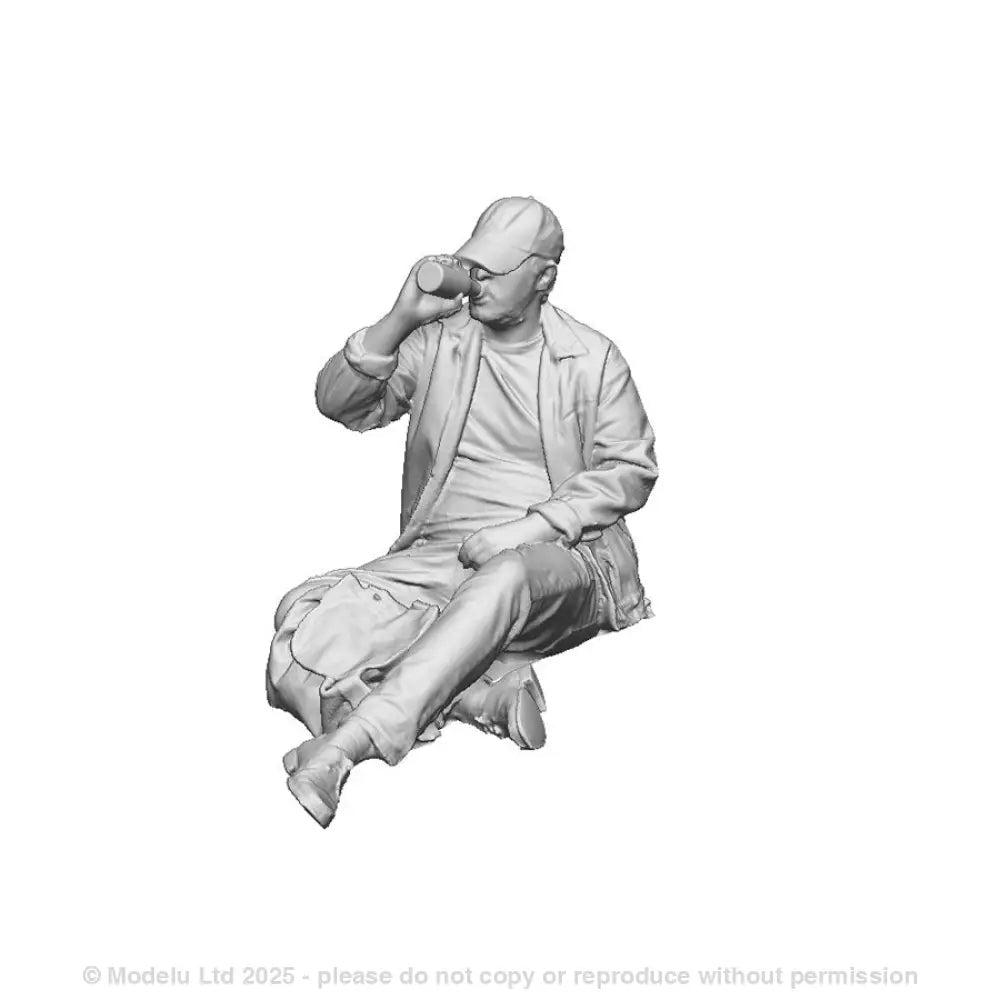 A seated man drinking
